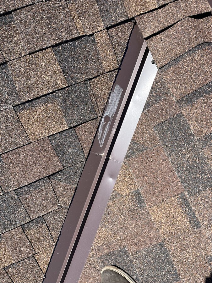 Hail damage assessment with marked impact points during roof inspection