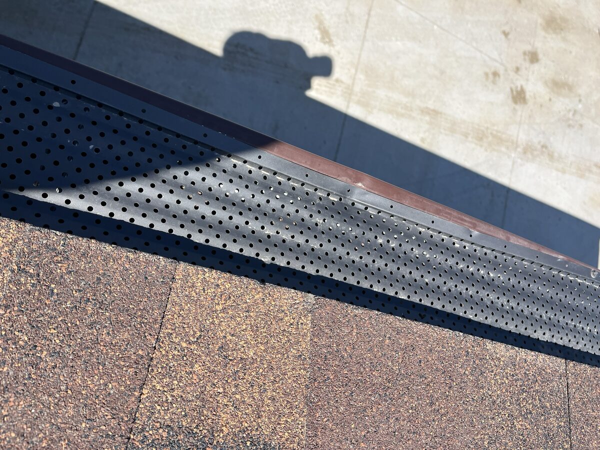 Hail-damaged roof vent cap on Omaha residential roof
